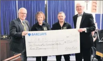  ??  ?? ■ Pictured, left to right: Adrian Walker (LOROS) with Lesley Bentley, Mike Wood and David Newman. Hathern Band hand over a cheque for more than £2,500 to LOROS hospice.