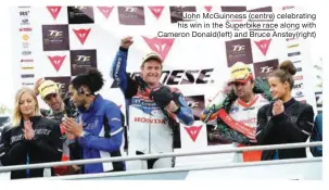  ??  ?? John McGuinness (centre) celebratin­g his win in the Superbike race along with Cameron Donald(left) and Bruce Anstey(right)