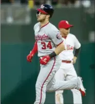  ?? LAURENCE KESTERSON — THE ASSOCIATED PRESS ?? The Nationals’ Bryce Harper (34) rounds the bases after hitting a three-run home run in the fourth inning Friday against the Phillies. The game ended too late for a story to appear in this edition. The Phillies lost, 17-7.