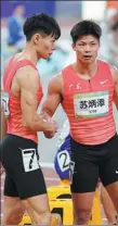  ?? XINHUA ?? Su Bingtian, 32, shakes hands with Chen Guanfeng, 21, following the men’s 100m final at the National Games on Tuesday. Su said this was likely his last appearance at the Games, but not his final race.