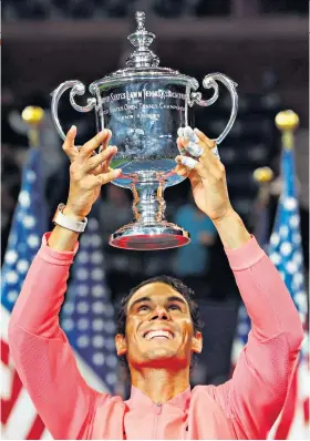  ??  ?? Just champion: Rafael Nadal lifts the US Open trophy after his victory