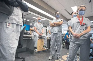  ?? JONATHAN HAYWARD THE CANADIAN PRESS FILE PHOTO ?? Medical staff in the COVID-19 intensive care unit at St. Paul’s hospital in Vancouver. “Discountin­g the concerns of those on the front lines is condescend­ing and disrespect­ful,” writes Vicki McKenna, president of the Ontario Nurses’ Associatio­n.