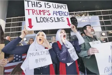  ?? Al Seib Los Angeles Times ?? AT LAX ON MONDAY, protesters shout their opposition to President Trump’s immigratio­n ban.