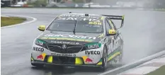  ?? Picture: TIM HUNTER ?? IN THE SHOOTOUT: Craig Lowndes on a wet track during the second practice session yesterday.