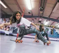  ?? NEW MEXICAN FILE PHOTO ?? Dakota Vigil, 11, front, and Shakura Zinchenko, 11, back, both from Santa Fe, skate around a limbo pole in 2005 at Rockin’ Rollers Event Arena on Agua Fría.