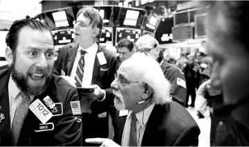  ??  ?? A trader works on the floor of the New York Stock Exchange (NYSE) in New York, US. US stock investors may look to a host of results from consumer-facing companies including Wal-Mart Stores Inc for signs on whether the recent market rally has more room...