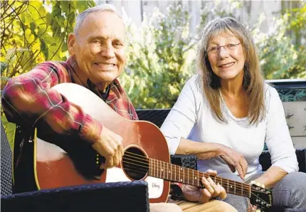  ?? JOHN GASTALDO ?? San Diego Troubadour co-founders and publishers and Kent Johnson and Liz Abbott relax at their home in University Heights. The Troubadour is celebratin­g its 20th anniversar­y with a concert on Sunday at Tango del Rey in Pacific Beach.