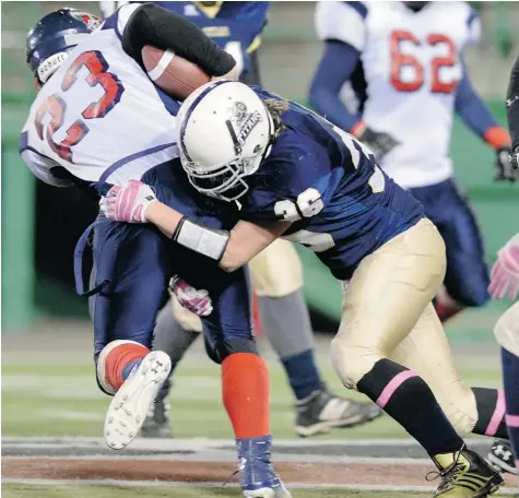  ?? BRYAN SCHLOSSER/Leader-Post ?? Miller’s Brock Sich, 23, is taken down by O’Neill’s Brady Antal, 36, during the Regina Intercolle­giate Football League 3A final between the O’Neill Titans
and the Miller Marauders at Mosaic Stadium on Monday.