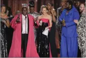  ?? CHARLES SYKES — INVISION/AP ?? Michael R. Jackson, second from left, accepts the award for best new musical for “A Strange Loop” at the 75th annual Tony Awards on Sunday in New York.