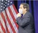 ?? WILFREDO LEE/AP ?? Democrats want Gov. Ron DeSantis to mandate wearing of masks to curb the spread of coronaviru­s.
