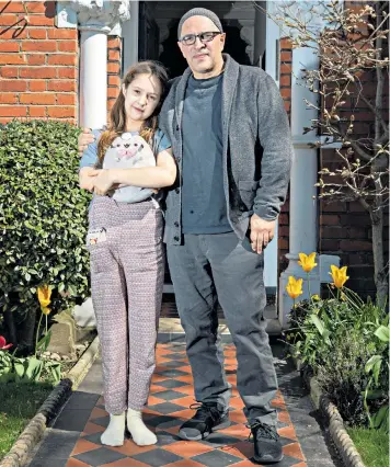  ??  ?? Happy to be home: Dominic Minghella with his daughter Rosa, 11, on Saturday