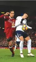  ??  ?? TOUGH TIME: Liverpool’s Virgil van Dijk, left, vies with Tottenham’s Erik Lamela during a recent Premier League game.