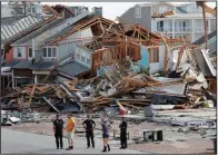  ?? AP file photo ?? Rescuers on Oct. 11 in Mexico Beach, Fla., comb the wreckage left behind by Hurricane Michael.