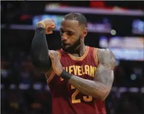  ?? JAE C. HONG — THE ASSOCIATED PRESS FILE ?? In this file photo, Cleveland Cavaliers forward LeBron James celebrates after scoring during a game against the Los Angeles Lakers last season. The superstar declined his $35.6 million contract option on Friday with Cleveland and is a free agent as of...