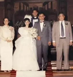  ??  ?? FROM ONE FATHER TO ANOTHER Mr. and Mrs. John stood as godparents when the author’s parents got married in 1989