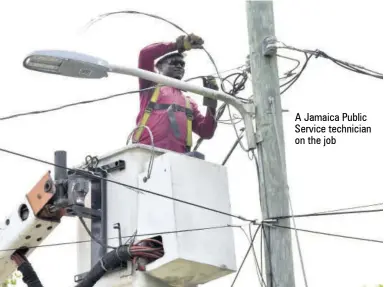  ??  ?? A Jamaica Public Service technician on the job