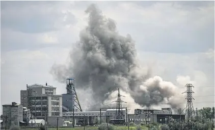  ?? AFP ?? Smoke rises from a factory in the city of Soledar at the eastern Ukranian region of Donbas after a Russian air strike on Tuesday.