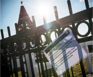  ??  ?? The area next to the National Christmas Tree is closed in Washington, DC. US lawmakers headed home for Christmas leaving the government partially shut in an impasse over Trump’s demand for border wall funding. — AFP photo