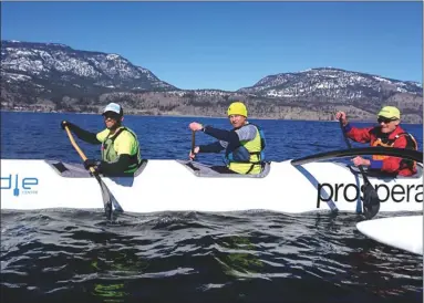  ?? LEANNE STANLEY/Special to The Daily Courier ?? Outrigger canoeists took to Okanagan Lake under clear blue skies Sunday. Shown from left are Kale McMahon, Mike Rowley, and Hugh Culver.