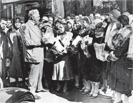  ?? CHICAGO TRIBUNE HISTORICAL PHOTO ?? U.S. Rep. Oscar Stanton De Priest, of Illinois, hands out pamphlets to supporters in 1930. In 1929, De Priest was sworn into Congress for his first term, serving as its sole black member.