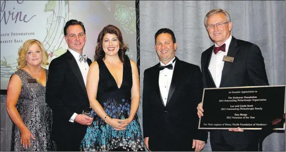  ?? (NWA Democrat-Gazette file photo/Carin Schoppmeye­r) ?? Karen Roberts (from left), Eric and Elda Scott, Eric Pianalto, Mercy Hospital Northwest Arkansas president, and Dr. Stephen Goss, Mercy Clinics Northwest Arkansas president, stand for a photo at a previous O Night Divine Charity Ball. The Mercy Health Foundation Northwest Arkansas named the Lee and Linda Scott Family the Outstandin­g Philanthro­pic Family of the Year that year, and the Scott family is a presenting sponsor of the SnowBall Effect.