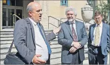  ?? [TOM DODGE/DISPATCH] ?? Ed Hastie, left, attorney for ComFest, speaks with ComFest’s Michael Gruber, center, and Doug Gouty after Tuesday’s hearing in federal court.