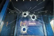  ?? BEN BIRCHALL/PA VIA AP ?? Hammer holes in the glass case that housed the Magna Carta, at Salisbury Cathedral after a 45-year-old man has been arrested on suspicion of its attempted theft, in Salisbury, England, Friday Oct. 26. British police said Friday that cathedral alarms sounded Thursday when a person tried to smash the glass display box surroundin­g the Magna Carta, which was then removed from display in Salisbury Cathedral, and a man has been arrested.