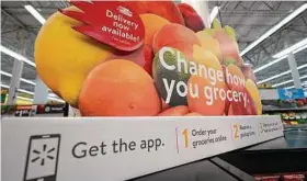  ?? David J. Phillip / Associated Press ?? Grocery delivery services are growing rapidly, but shoppers need to decide if the convenienc­e is worth the higher cost.