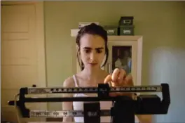  ?? GILLES MINGASSON, NETFLIX ?? Lily Collins stars as Ellen, a young woman living with an eating disorder, in "To the Bone," a film that has sparked much conversati­on about the illness.