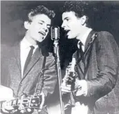 ?? AP 1964 ?? The Everly Brothers — Phil, left, and Don — perform on stage. Don Everly died Saturday at his home in Nashville, Tenn. The duo are in the rock & roll and country hall of fames.
