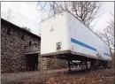  ?? Grace Duffield / Hearst Connecticu­t Media ?? Equipment for a skating rink has been delivered in New Canaan and is being stored in this trailer behind the Carriage Barn.