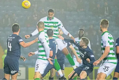  ?? Picture: SNS Group. ?? Christophe­r Jullien gets up highest to head in Celtic’s third goal.