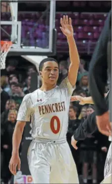  ?? PETE BANNAN — DIGITAL FIRST MEDIA ?? Penncrest’s Tyler Norwood acknowledg­es admirers as he leaves the court in the final minute of Penncrest’s 50-28 victory over Bishop Shanahan in the District 1 Class 5A championsh­ip game at Temple’s Liacouras Center on Saturday.