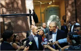  ?? DAN SOKIL — MEDIANEWS GROUP ?? In a 2019 press conference, Gov. Tom Wolf, center left, and state Rep. Todd Stephens, R-151st, field questions about $3.8million in state grant funds to offset costs related to cleanup of PFAS contaminat­ion.