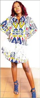  ?? ?? A Xhosa inspired long sleeve dress with white tassles designed by Monte Couture.
