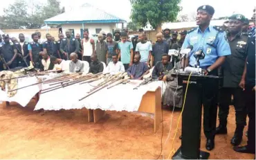  ??  ?? Force Public Relations Officer, CSP Jimoh Moshood (right), parades suspected kidnappers and armed robbers responsibl­e for several kidnap for ransom of innocent travelers along the Abuja-Kaduna Highway yesterday