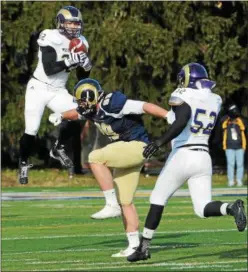  ?? DIGITAL FIRST MEDIA FILE ?? WCU’s Brandon Pepper (32) picks off a pass meant for Shepherd’s Jamie Deason (89 during an NCAA Division II quarterfin­al on Dec. 7, 2013. Shepherd and WCU will now be conference rivals, after Shepherd joins the PSAC in 2019.