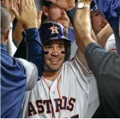  ?? Melissa Phillip / Houston Chronicle ?? Second baseman Jose Altuve celebrates after scoring in the Astros’ five-run seventh inning.