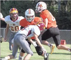  ?? Scott Herpst ?? Lafayette tailback Dawson Pendergras­s picks up a block from Cody Davis en route to a big gain against Dade on Thursday. The Ramblers pulled out a 20-14 victory.