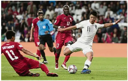  ?? — AP ?? Eyes on the ball: South Korea’s Hwang Hee-chan taking a shot during the Asian Cup Group C match against Kyrgyzstan at the Hazza Bin Zayed Stadium in Al Ain, the United Arab Emirates, on Friday.