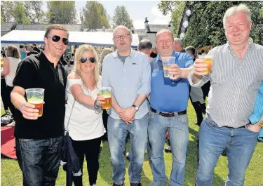  ??  ?? Cheers to that Eaglesham Beer Festival punters enjoy the sun at last year’s event