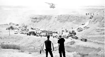  ??  ?? Israeli rescue services personnel operate near the site where a group of Israeli youths was swept away by a flash flood, near the Zafit river bed, south to the Dead Sea. — Reuters photo