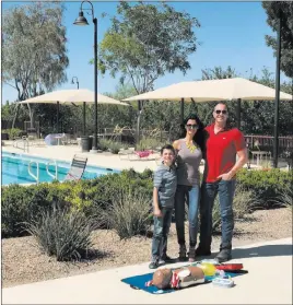  ??  ?? Inspirada Ryan Franklin, his wife, Damiana, and step-son Philip are residents in Inspirada where they enjoy family-friendly lifestyle programmin­g, lush walking and jogging trails, parks equipped with various sports fields and various pools to keep them...