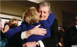  ?? — AP ?? BATON ROUGE: Louisiana state treasurer John Kennedy hugs his wife Becky after addressing supporters at his election watch party, after being elected to the senate seat vacated by Sen. David Vitter, R-La.