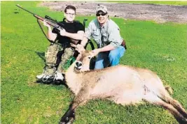  ?? TIM DAVIS/COURTESY ?? Tim Davis, an economics teacher at Cardinal Gibbons High School in Fort Lauderdale, takes critically ill and disabled kids hunting and fishing. He guided Nick to this waterbuck.