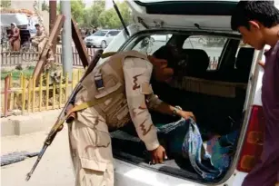  ?? (EPA) ?? Checking for Taliban in Lashkar Gah, the provincial capita l of He lmand that is in danger of fa ll ing to the militants