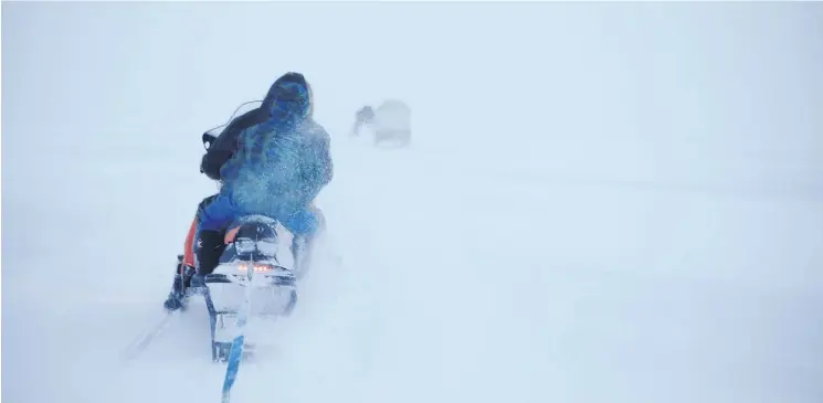  ?? PHOTOS: JONATHAN FRANTZ ?? Led by elders Michelline and Samueli, the Ammaaq family leaves Igloolik to retrieve their cache of igunaq — fermented walrus — which was carefully prepared and buried in the summer. “Igloolik has the right kind of rocks, so the meat doesn’t over-rot,”...