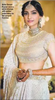  ??  ?? Actor Sonam Kapoor wore a white lehenga with golden embroidery for her sangeet function