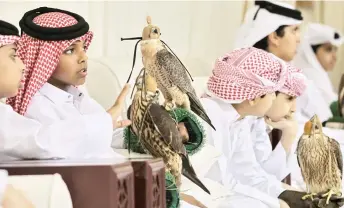  ?? ?? Contestant­s with their falcons during a junior falconry competitio­n.