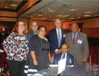  ?? CONTRIBUTE­D ?? Waverly Glover (seated) was inducted into the Ohio Veterans’ Hall of Fame in 2015. He is shown with volunteers and staff of the Dayton Foundation and his daughter Pam. Gina Sandoval, marketing and communicat­ions officer at the foundation, wrote his nomination.